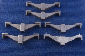 SIX Dummy Leaf Springs - Cast Iron,190mm ovrl width, 20mm thick, 40 x 20mm centre buckle- can be drilled to take a coil spring, 7 1/4"g - 10 1/4" g.